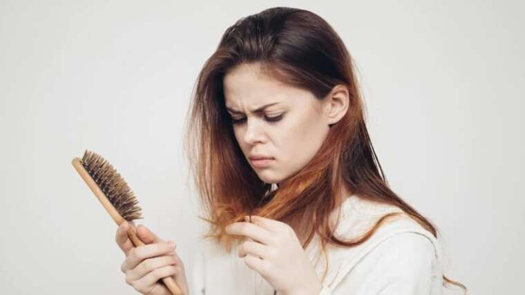 Navigating Postpartum Hair Loss: Unraveling Causes and Discovering Solutions for New Mothers